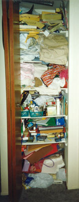 Linen closet before being organized